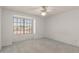 Bright bedroom featuring carpet floors, a window and white walls at 987 E Divot Dr, Tempe, AZ 85283