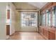 Dining area with wood floors, and a large window with built-in cabinets on the right at 987 E Divot Dr, Tempe, AZ 85283