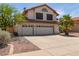 This inviting two-story home features a three-car garage and low-maintenance landscaping at 987 E Divot Dr, Tempe, AZ 85283