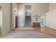 Spacious living room with stairs leading up to the second floor with hardwood floors and ample natural light at 987 E Divot Dr, Tempe, AZ 85283