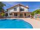 Sparkling pool features a curved edge and easy-access steps, perfect for relaxation and recreation at 987 E Divot Dr, Tempe, AZ 85283