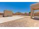 Large backyard area featuring a patio, storage, and block fence at 10009 W Bloch Rd, Tolleson, AZ 85353