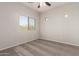 Neutral bedroom featuring a window and carpeted floors at 10009 W Bloch Rd, Tolleson, AZ 85353