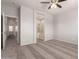 View of bedroom that opens into a bathroom with tub and glass shower at 10009 W Bloch Rd, Tolleson, AZ 85353