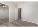 Neutral bedroom featuring a ceiling fan, carpeted floors, and an attached closet at 10009 W Bloch Rd, Tolleson, AZ 85353