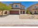 Charming two-story home with a well-manicured yard and a two-car garage at 10009 W Bloch Rd, Tolleson, AZ 85353