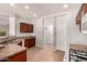 Bright kitchen featuring dark cabinets, tile flooring, and modern appliances at 10009 W Bloch Rd, Tolleson, AZ 85353