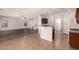 Open-concept kitchen featuring dark cabinets and an island, with tile flooring at 10009 W Bloch Rd, Tolleson, AZ 85353