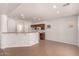 Charming kitchen area with breakfast bar and dark wood cabinets at 10009 W Bloch Rd, Tolleson, AZ 85353