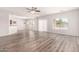 Spacious living room featuring modern floors, neutral paint, and lots of natural light at 10009 W Bloch Rd, Tolleson, AZ 85353