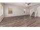 Bright and airy living room with modern floors and neutral paint at 10009 W Bloch Rd, Tolleson, AZ 85353