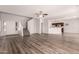 Open-concept living space featuring modern floors and access to the kitchen at 10009 W Bloch Rd, Tolleson, AZ 85353