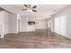 Spacious living room featuring modern floors, neutral paint, and a ceiling fan at 10009 W Bloch Rd, Tolleson, AZ 85353