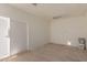 Neutral colored room with wood floors waiting to be completed at 10009 W Bloch Rd, Tolleson, AZ 85353