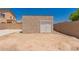 Storage shed with block fence surrounding large backyard space at 10009 W Bloch Rd, Tolleson, AZ 85353