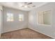 Neutral bedroom with bright, natural light and ceiling fan at 10331 W Devonshire Ave, Phoenix, AZ 85037