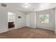 Bright bedroom features a window for natural light and neutral colored walls, creating a comfortable atmosphere at 10331 W Devonshire Ave, Phoenix, AZ 85037