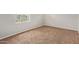 This bedroom has neutral-toned walls and brown carpet at 10331 W Devonshire Ave, Phoenix, AZ 85037