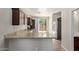 Modern kitchen featuring granite countertops, stainless steel appliances, and ample storage for a delightful cooking experience at 10331 W Devonshire Ave, Phoenix, AZ 85037