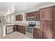 Well-equipped kitchen with granite countertops, sleek appliances, and abundant cabinet space for efficient meal preparation at 10331 W Devonshire Ave, Phoenix, AZ 85037