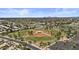 Aerial view showcasing baseball fields, a pond, and the surrounding neighborhood at 1244 W Straford Ave, Gilbert, AZ 85233