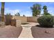 Backyard features a built-in barbecue and desert landscaping at 1244 W Straford Ave, Gilbert, AZ 85233