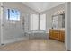 Bright bathroom with marble shower and separate tub at 1244 W Straford Ave, Gilbert, AZ 85233