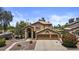 Charming two-story home with stucco exterior, three-car garage, and manicured front yard at 1244 W Straford Ave, Gilbert, AZ 85233