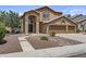 Charming two-story home with stucco exterior, three-car garage, and manicured front yard at 1244 W Straford Ave, Gilbert, AZ 85233