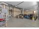 A spacious garage with epoxy floors, lots of storage and multiple overhead garage doors at 1244 W Straford Ave, Gilbert, AZ 85233