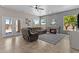 Inviting living room with cozy fireplace, plush seating, and abundant natural light at 1244 W Straford Ave, Gilbert, AZ 85233