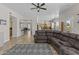 Spacious living room showcasing seamless flow to the kitchen and dining area at 1244 W Straford Ave, Gilbert, AZ 85233
