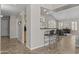 Open living area with bar seating connecting to the formal dining area and seating at 1244 W Straford Ave, Gilbert, AZ 85233