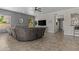 Cozy living room with large sectional couch, fireplace, and modern decor at 1244 W Straford Ave, Gilbert, AZ 85233