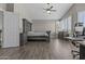 Serene main bedroom with a ceiling fan, shutters, and wood-style flooring at 1244 W Straford Ave, Gilbert, AZ 85233
