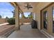 Covered back patio with ceiling fan and access to the backyard at 1244 W Straford Ave, Gilbert, AZ 85233