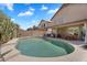 Inviting backyard with a pool, covered patio, and lush greenery at 1264 S Sierra St, Gilbert, AZ 85296