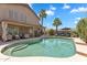 Expansive backyard featuring a pristine pool, palm trees, and ample lounging space at 1264 S Sierra St, Gilbert, AZ 85296