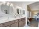 Elegant bathroom featuring dual sinks, modern fixtures, granite countertop, and a stylish vanity, exuding comfort at 1264 S Sierra St, Gilbert, AZ 85296
