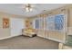 Bright bedroom with a seating area, and natural light from the windows at 1264 S Sierra St, Gilbert, AZ 85296