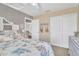 Bedroom featuring neutral tones, a bed with patterned linens, and access to an open doorway and closet at 1264 S Sierra St, Gilbert, AZ 85296