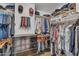 Walk-in closet with custom shelving, hanging racks, hats, and drawers offer ample storage space at 1264 S Sierra St, Gilbert, AZ 85296