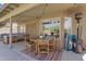 Relaxing covered patio featuring an outdoor dining area and lounge furniture at 1264 S Sierra St, Gilbert, AZ 85296