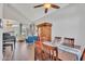 Dining room with wooden table, vaulted ceiling, and view into the living room with upright piano at 1264 S Sierra St, Gilbert, AZ 85296