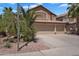 Inviting two-story home with a three-car garage complemented by desert landscaping at 1264 S Sierra St, Gilbert, AZ 85296