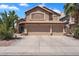 Inviting two-story home featuring a three-car garage and lush landscaping in a vibrant neighborhood at 1264 S Sierra St, Gilbert, AZ 85296