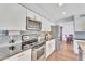Well-equipped kitchen features stainless steel appliances, granite countertops, and ample white cabinetry at 1264 S Sierra St, Gilbert, AZ 85296