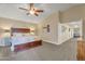 Serene main bedroom with a spacious layout, ceiling fan, and doorway, perfect for unwinding after a long day at 1264 S Sierra St, Gilbert, AZ 85296
