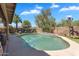 Private pool area surrounded by lush landscaping and a covered patio at 1264 S Sierra St, Gilbert, AZ 85296