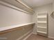 Walk-in closet with multiple shelves and clothing rods for ample storage at 1563 E Peregrine Trl, Casa Grande, AZ 85122